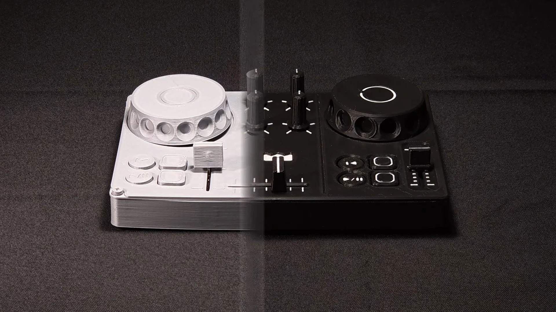 The two DJC-DIY versions side by side, seen from above: the earlier white print on the left, the new black v1.1.0 on the right